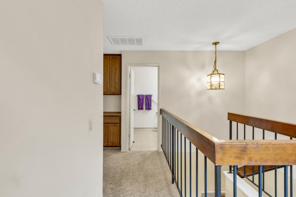 7025 Rancho Mirage Court Citrus Heights, CA 95621 - Photo 34 of 69 a view of a hallway with an entryway and wooden floor