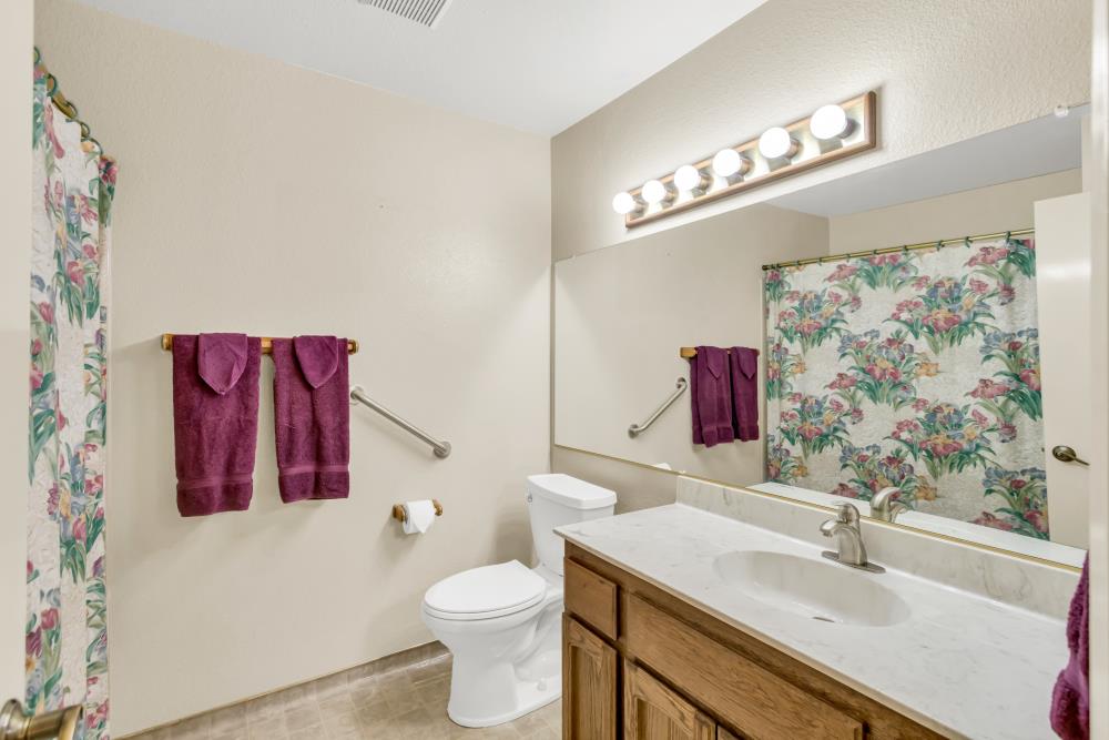 7025 Rancho Mirage Court Citrus Heights, CA 95621 - Photo 37 of 69 a bathroom with a sink and a mirror
