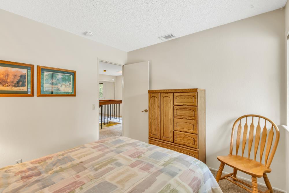 7025 Rancho Mirage Court Citrus Heights, CA 95621 - Photo 41 of 69 a bedroom with a bed and a chair