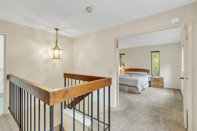 a view of a house with a tree in the background