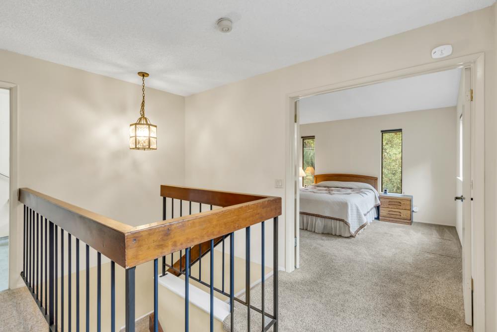 7025 Rancho Mirage Court Citrus Heights, CA 95621 - Photo 43 of 69 a bedroom with a bed and a chandelier