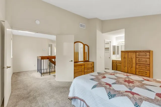 an aerial view of a house with yard and outdoor seating