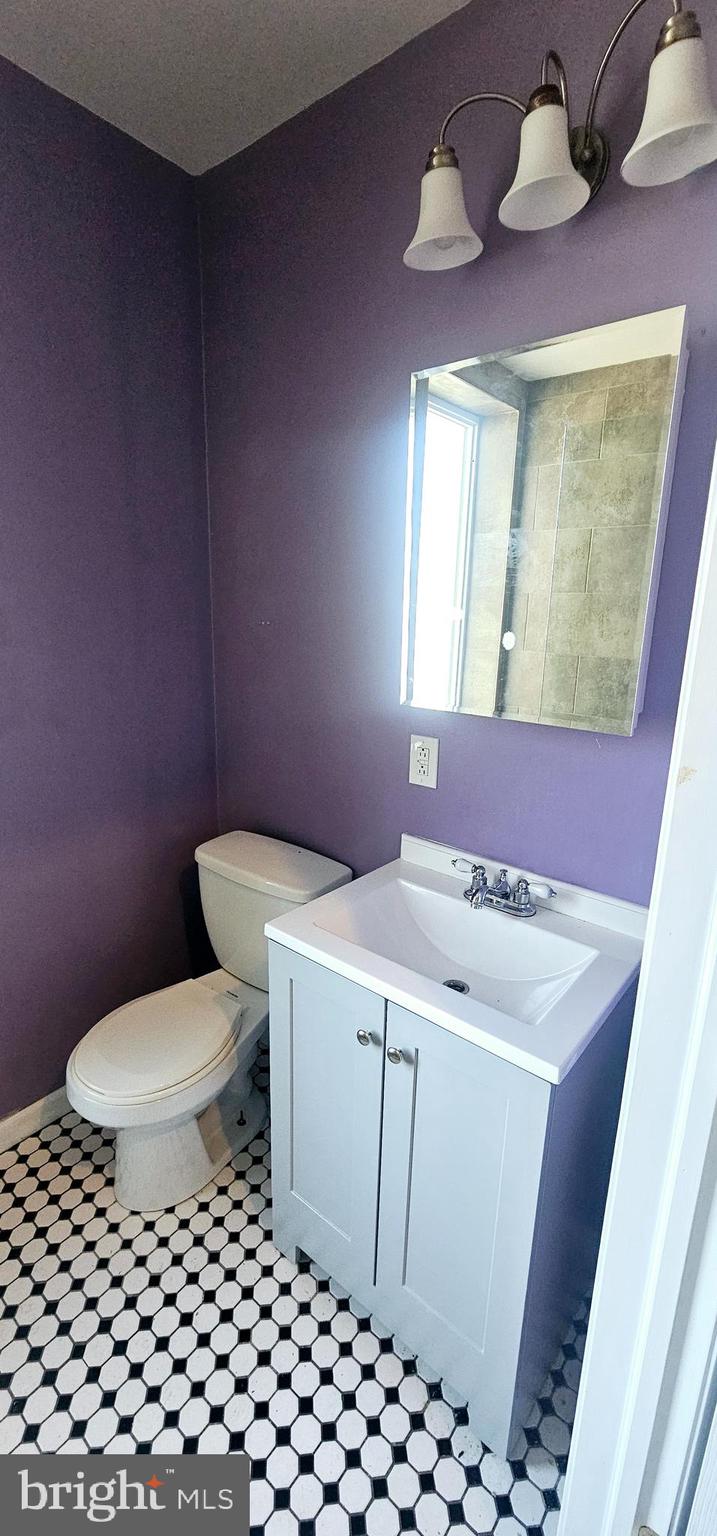 362 West Ritner Street, Unit 3 Philadelphia, PA 19148 - Photo 7 of 13 a bathroom with a sink a toilet and mirror