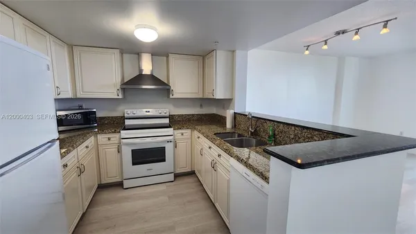a kitchen with a stove and a sink