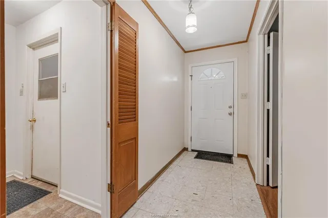 a view of a hallway with wooden floor and a hallway