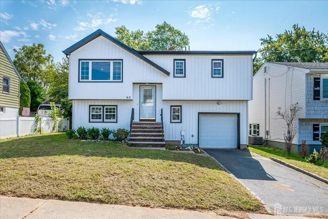 a view of a yard in front of a house with large trees