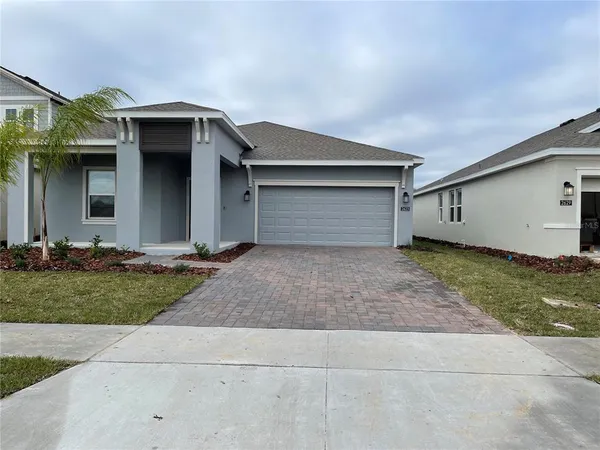 a house with a yard and garage