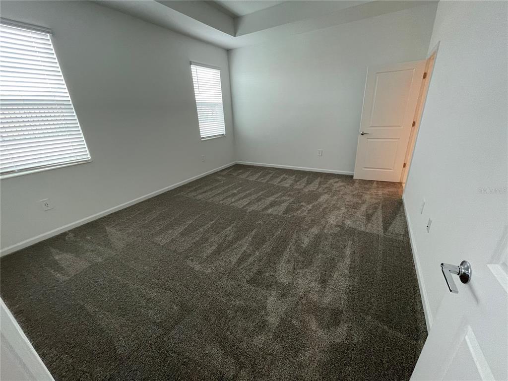 2623 Runners Circle Clermont, FL 34714 - Photo 14 of 21 an empty room with windows