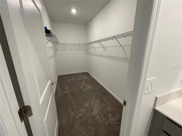 a bathroom with a double vanity sink and mirror