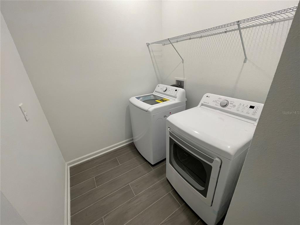 2623 Runners Circle Clermont, FL 34714 - Photo 18 of 21 a utility room with dryer and washer