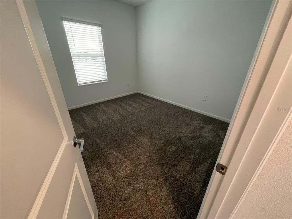 2623 Runners Circle Clermont, FL 34714 - Photo 4 of 21 an entryway door with a window