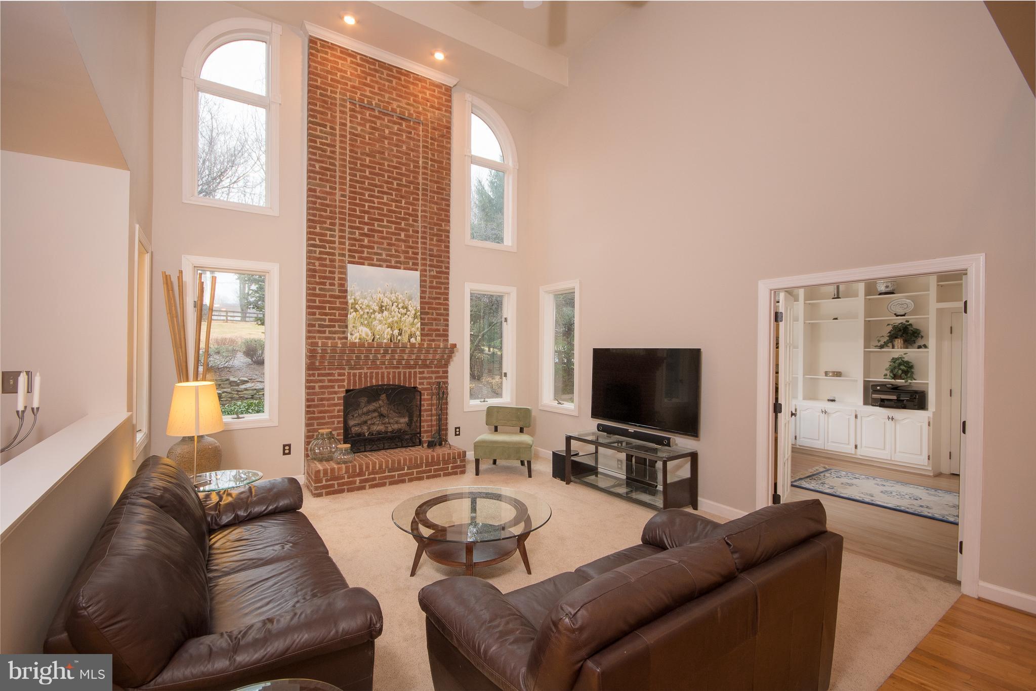 3111 Hunt Road Oakton, VA 22124 - Photo 10 of 30 Wall of windows and fireplace in Family Room