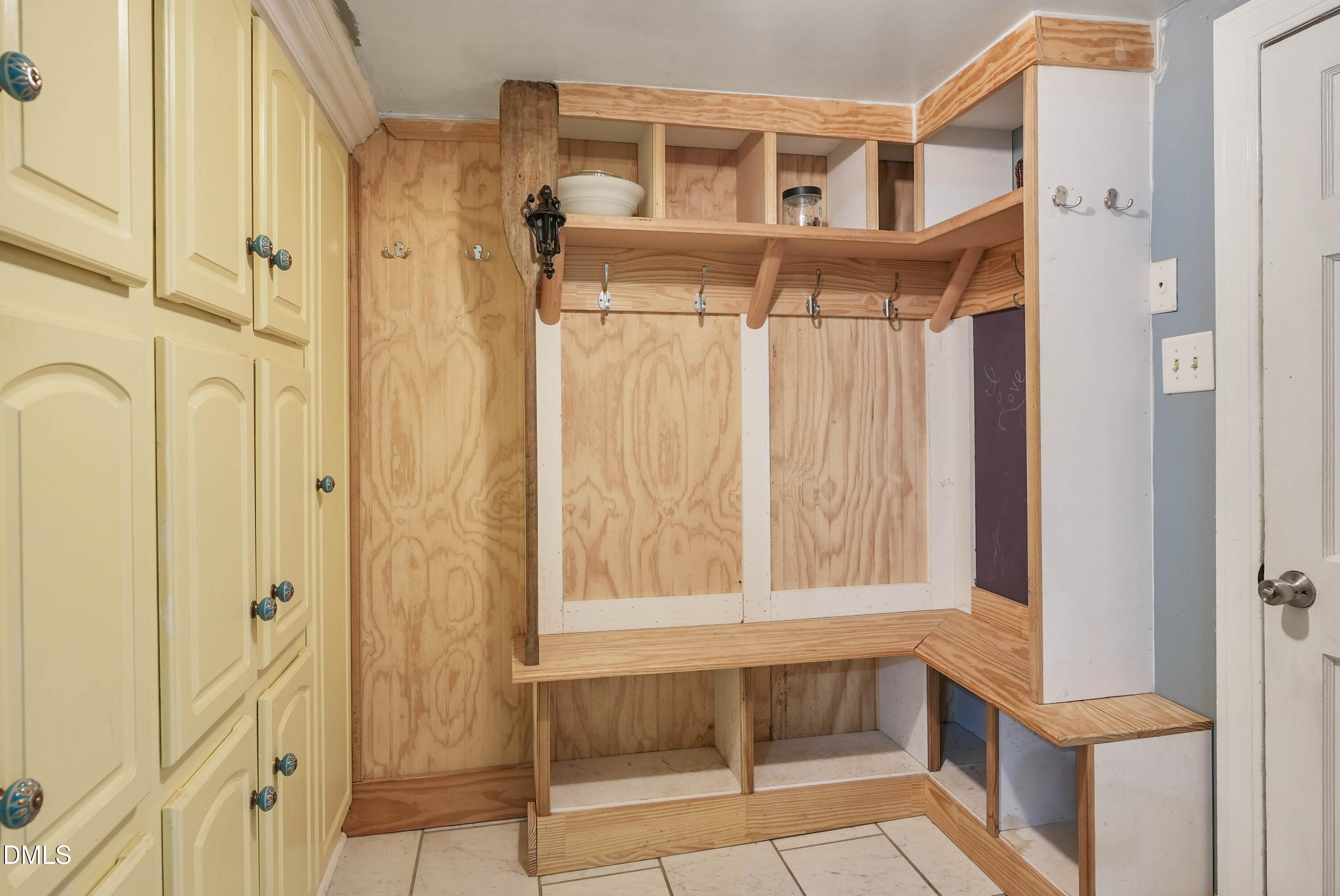 7406 Old Beulah Road Kenly, NC 27542 - Photo 13 of 30 Built-in storage solutions featuring shelving, coat hooks, and integrated cabinetry