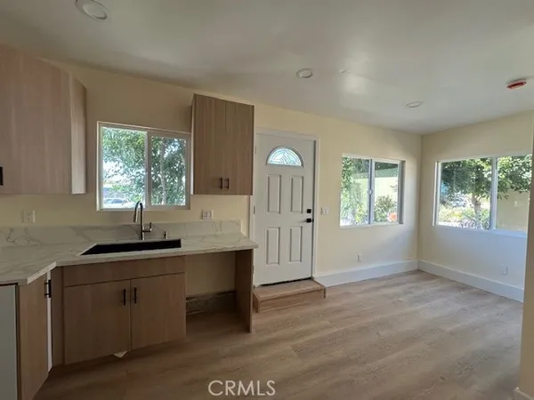 a kitchen with a sink and cabinets