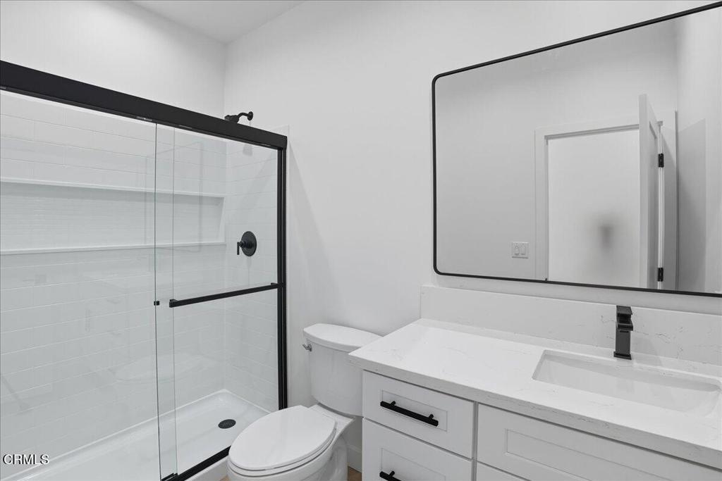 1907 Ocean Avenue Ventura, CA 93001 - Photo 21 of 51 a bathroom with a sink a toilet and shower