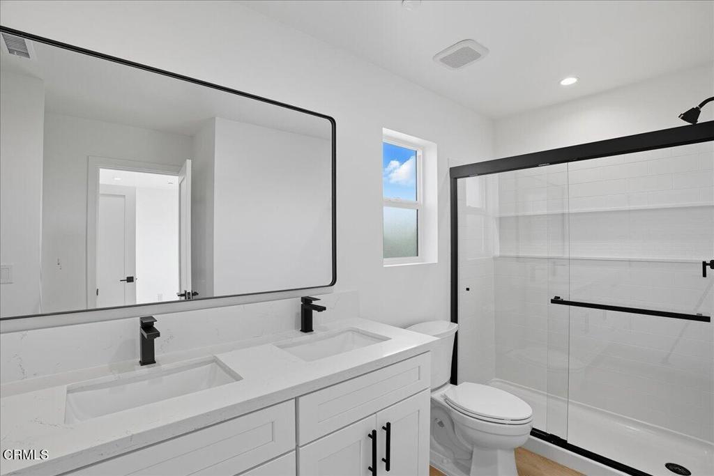 1907 Ocean Avenue Ventura, CA 93001 - Photo 29 of 51 a bathroom with a sink and a mirror