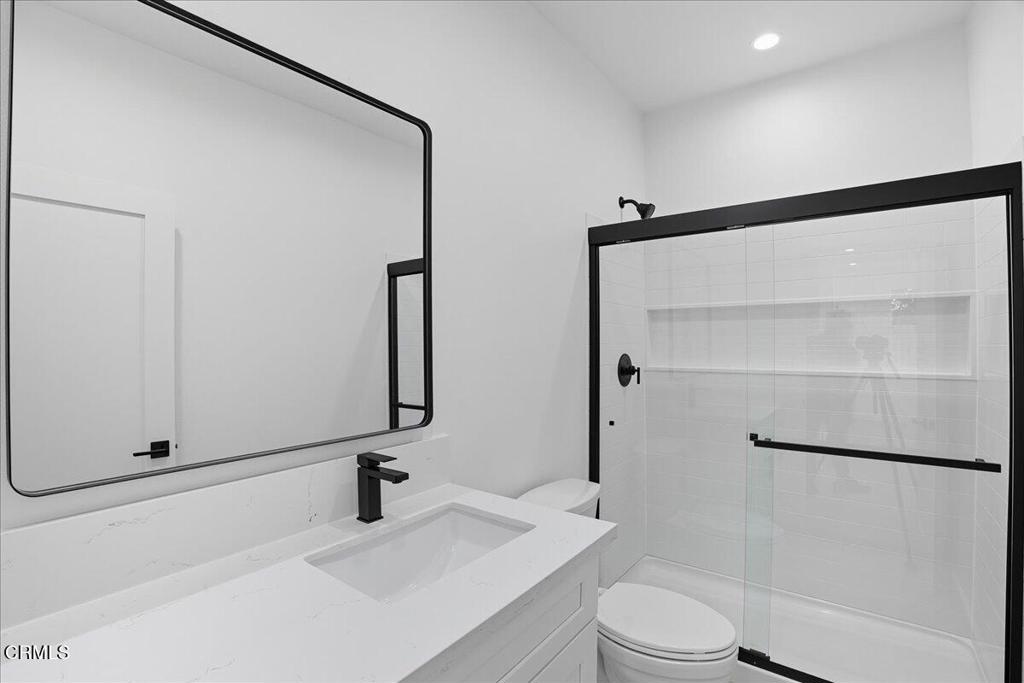 1907 Ocean Avenue Ventura, CA 93001 - Photo 37 of 51 a bathroom with a sink a toilet and shower