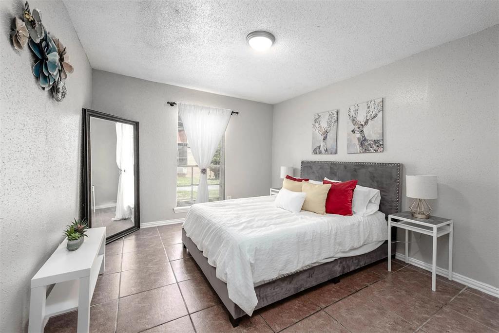 4300 Shaver Street, Unit 11 Houston, TX 77034 - Photo 3 of 8 a bedroom with a bed and a table