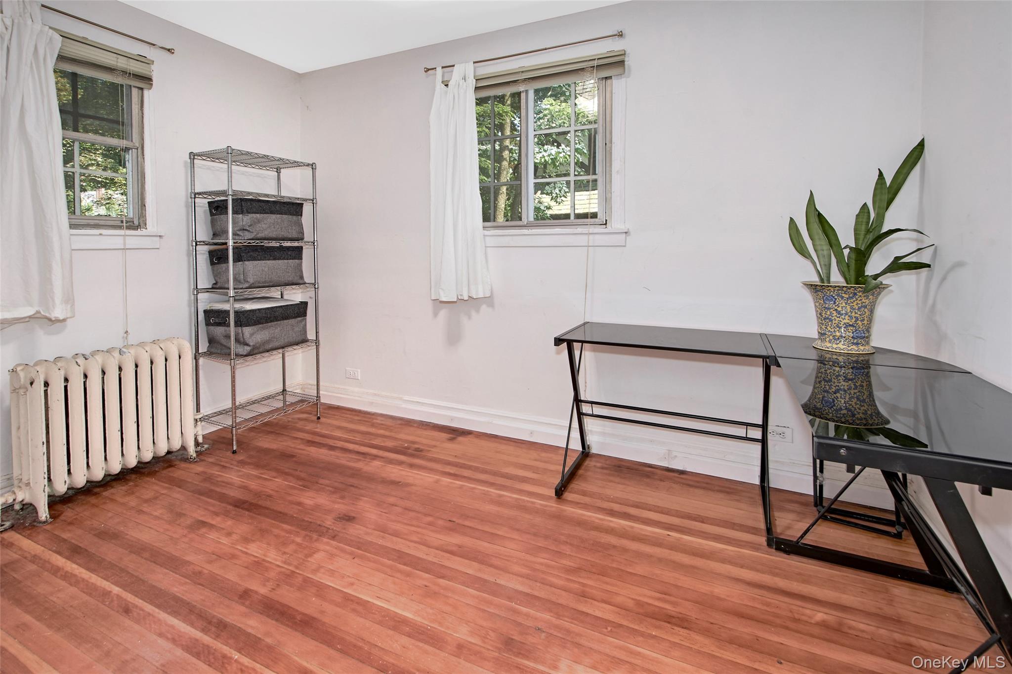 2 Byworth Road New Rochelle, NY 10804 - Photo 16 of 31 a view of livingroom with hardwood floor and window