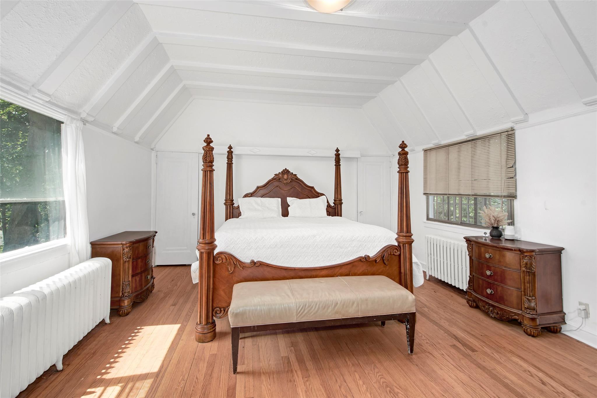 2 Byworth Road New Rochelle, NY 10804 - Photo 18 of 31 Bedroom featuring radiator heating unit, lofted ceiling, and light wood-style flooring