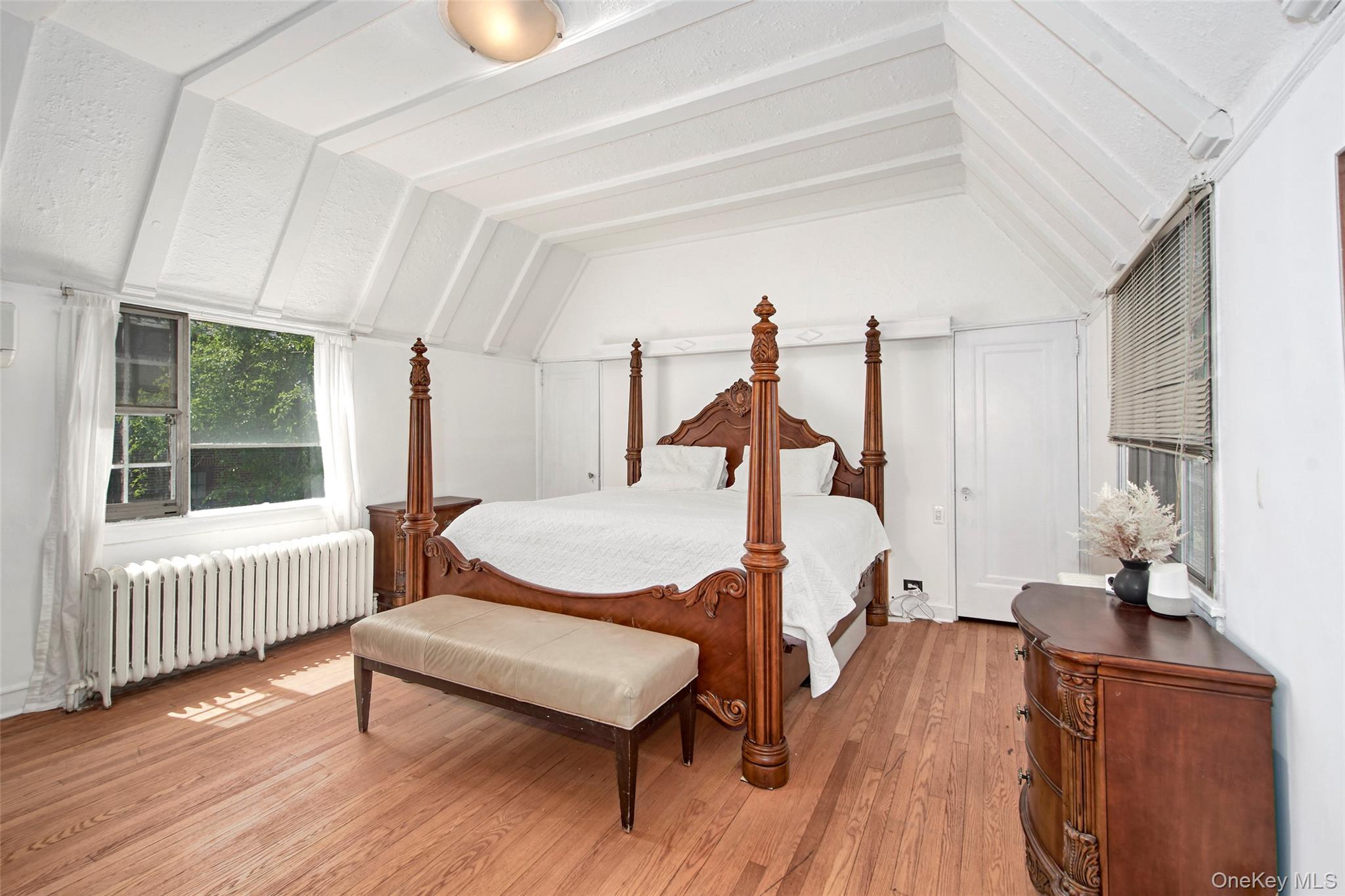 2 Byworth Road New Rochelle, NY 10804 - Photo 19 of 31 a bedroom with wooden floor bed and a window