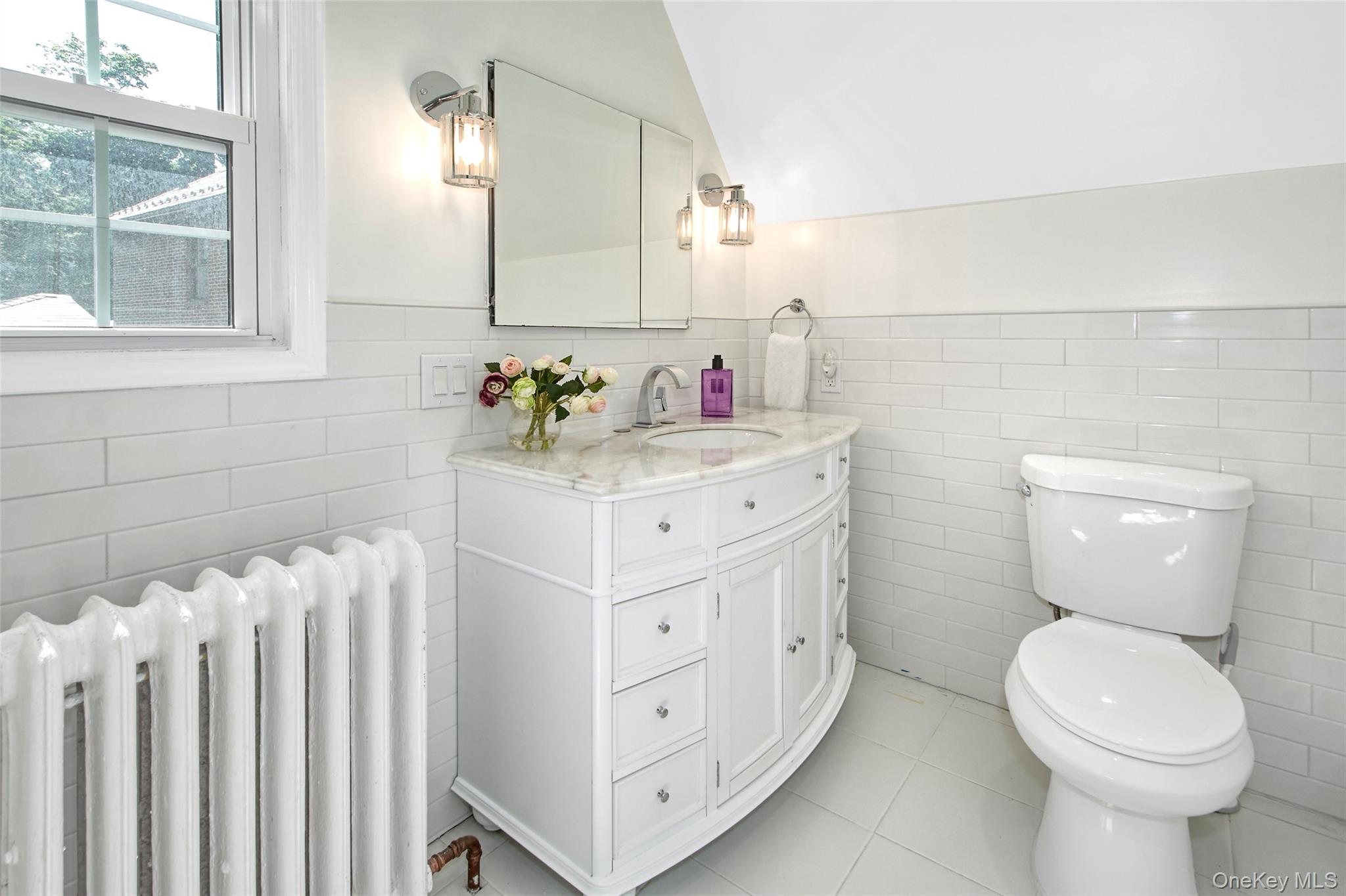 2 Byworth Road New Rochelle, NY 10804 - Photo 25 of 31 a bathroom with a sink a toilet and a mirror