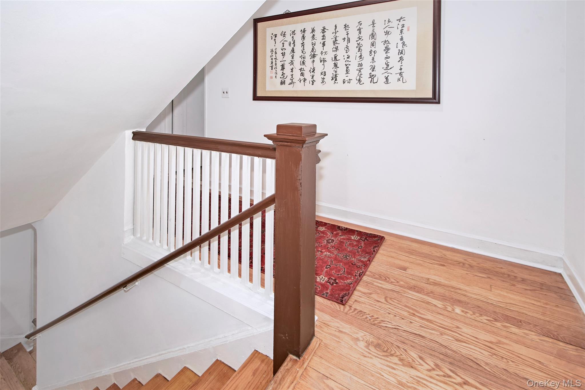 2 Byworth Road New Rochelle, NY 10804 - Photo 27 of 31 a view of a hallway with wooden floor and a large window