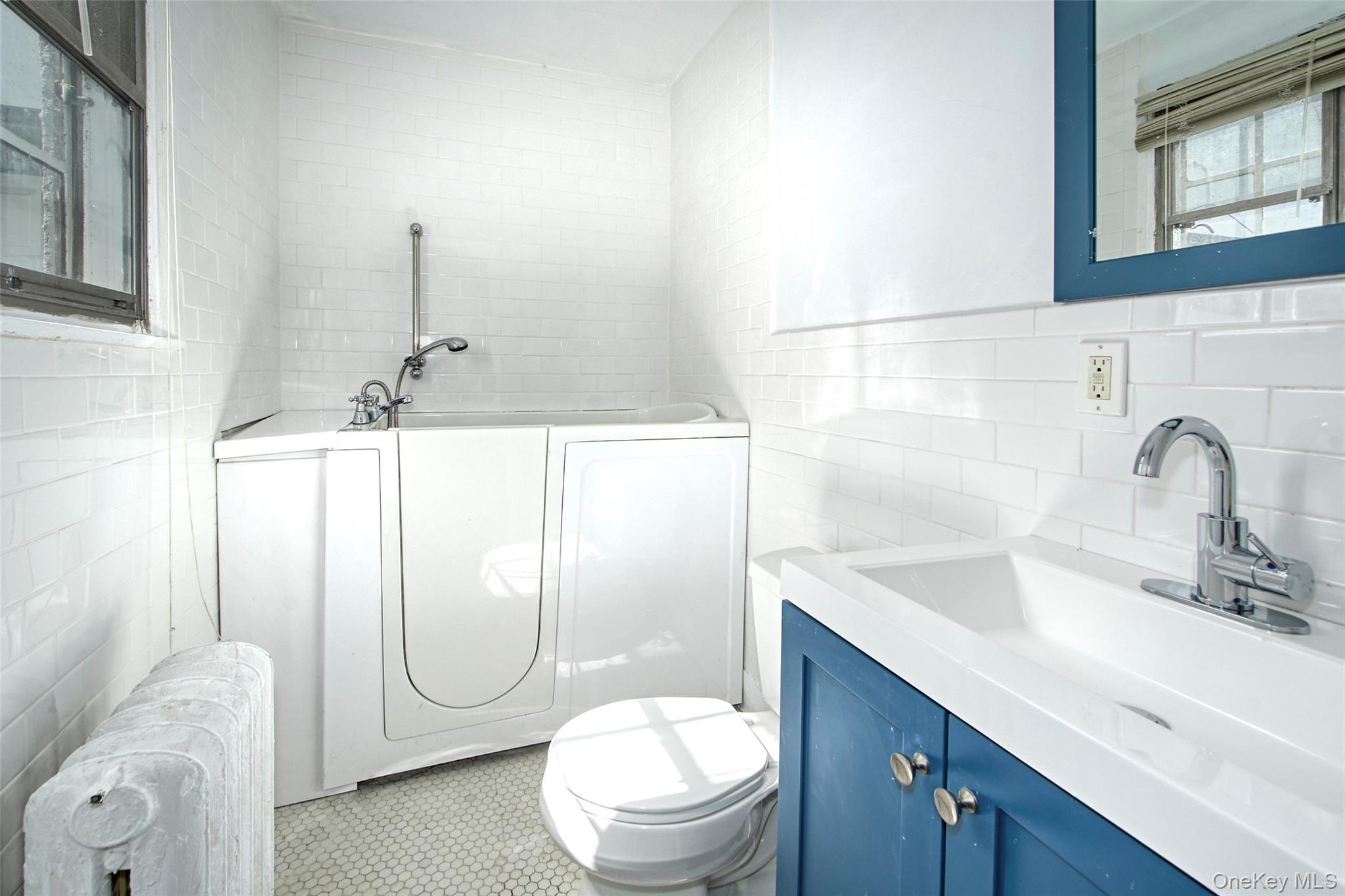 2 Byworth Road New Rochelle, NY 10804 - Photo 28 of 31 a bathroom with a sink a toilet and a mirror