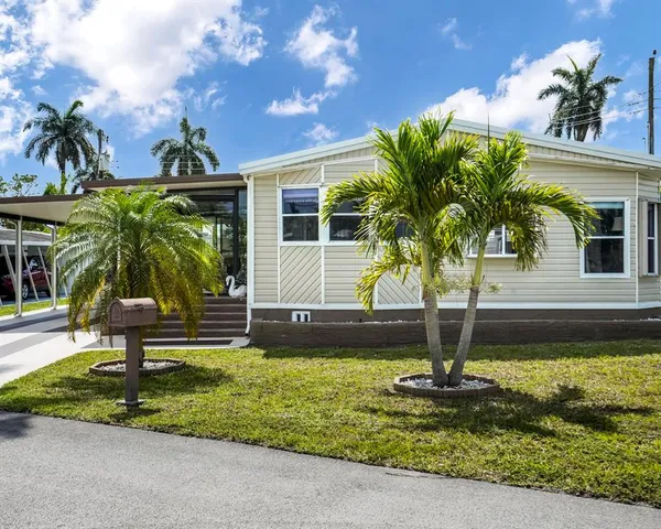 a large white building with a glass door
