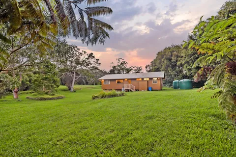 a view of a house with a big yard