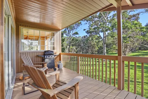 a view of a two chairs in the balcony