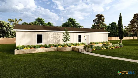 a view front of house with backyard and garden