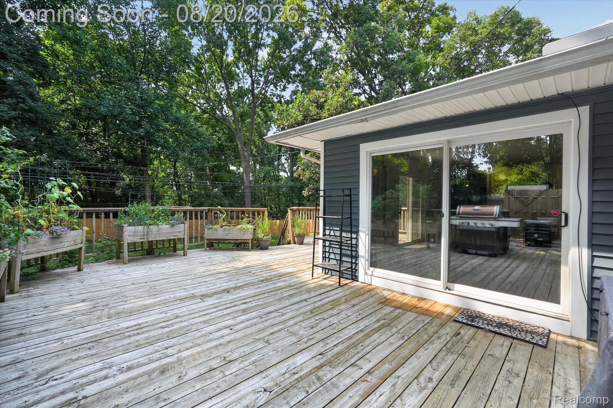 6235 Waldon Road Clarkston, MI 48346 - Photo 28 of 41 Expansive wood deck with a perimeter railing and mature trees