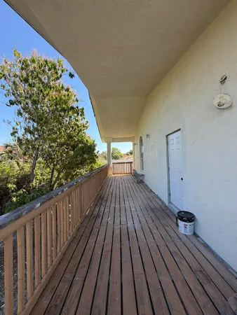 a view of a balcony with furniture