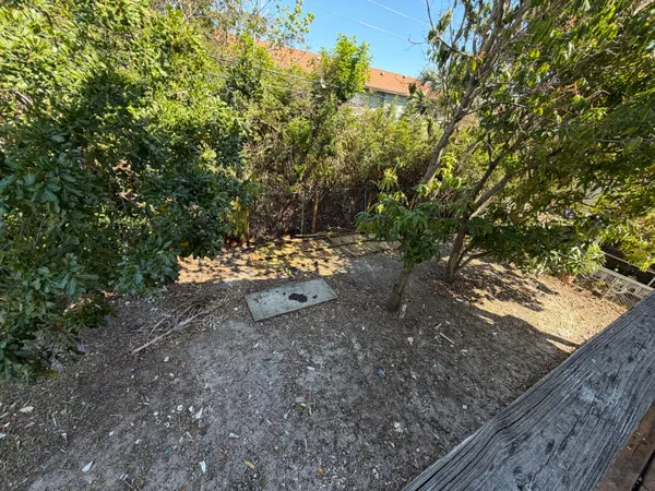 a view of a balcony with wooden floor