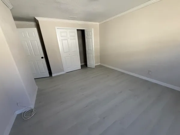 an empty room with a mirror