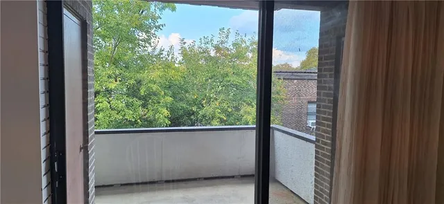 a view of a window in an empty room