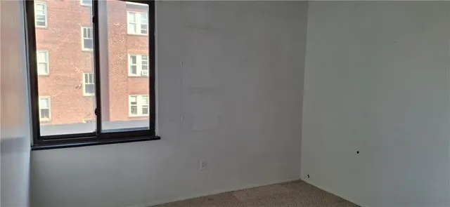 a balcony with table and chairs