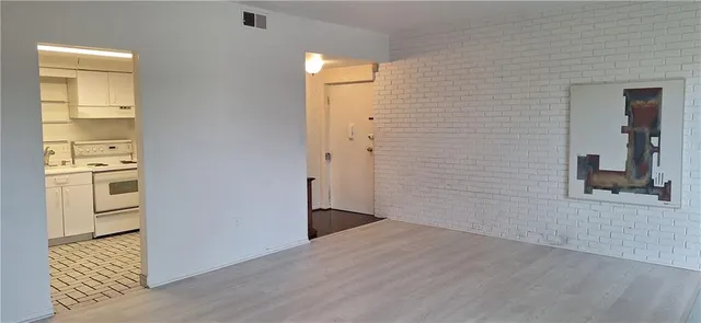 a dining room with furniture and chandelier