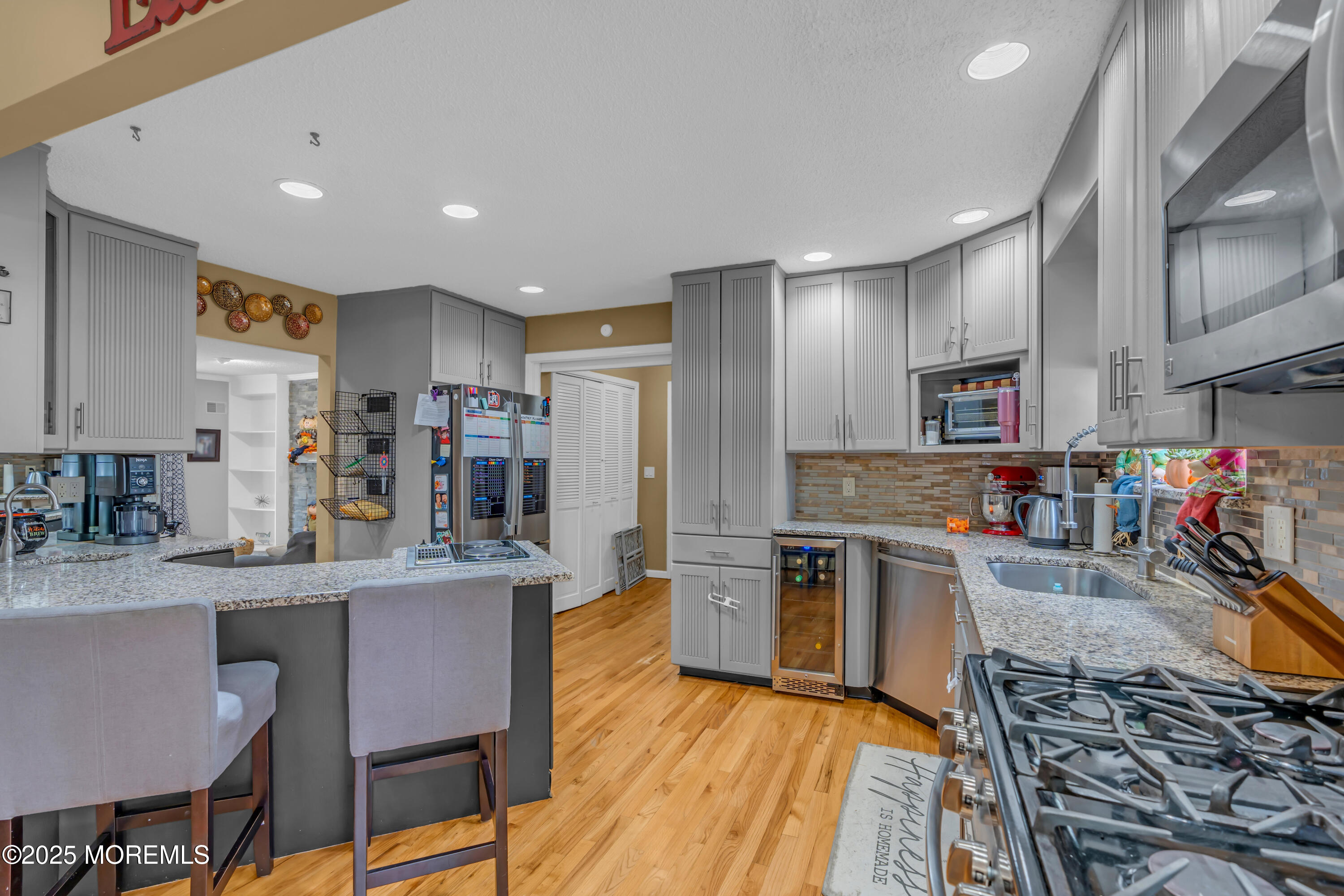 581 Winding River Road Brick, NJ 08724 - Photo 14 of 91 a kitchen with stainless steel appliances granite countertop a refrigerator and a stove top oven