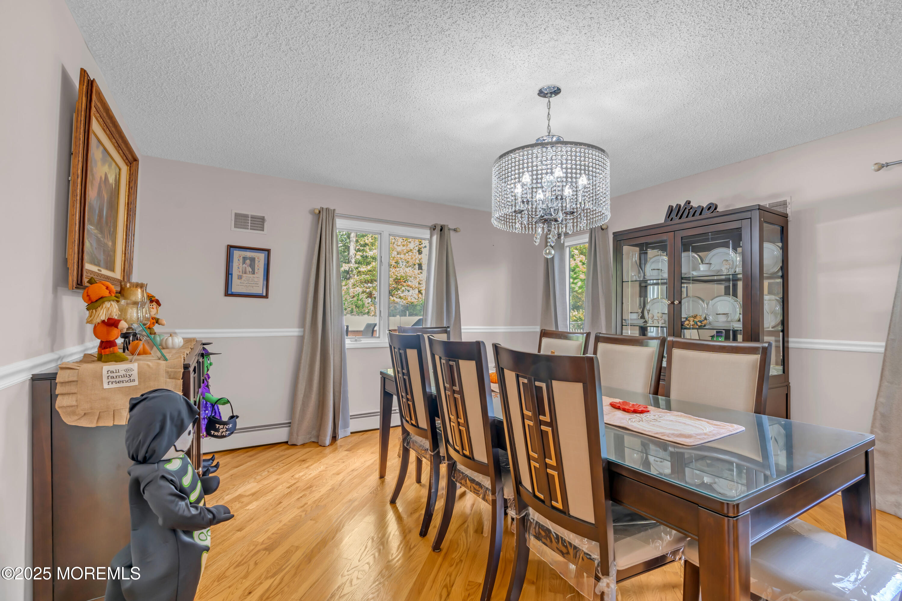 581 Winding River Road Brick, NJ 08724 - Photo 21 of 91 a view of a dining room with furniture and chandelier