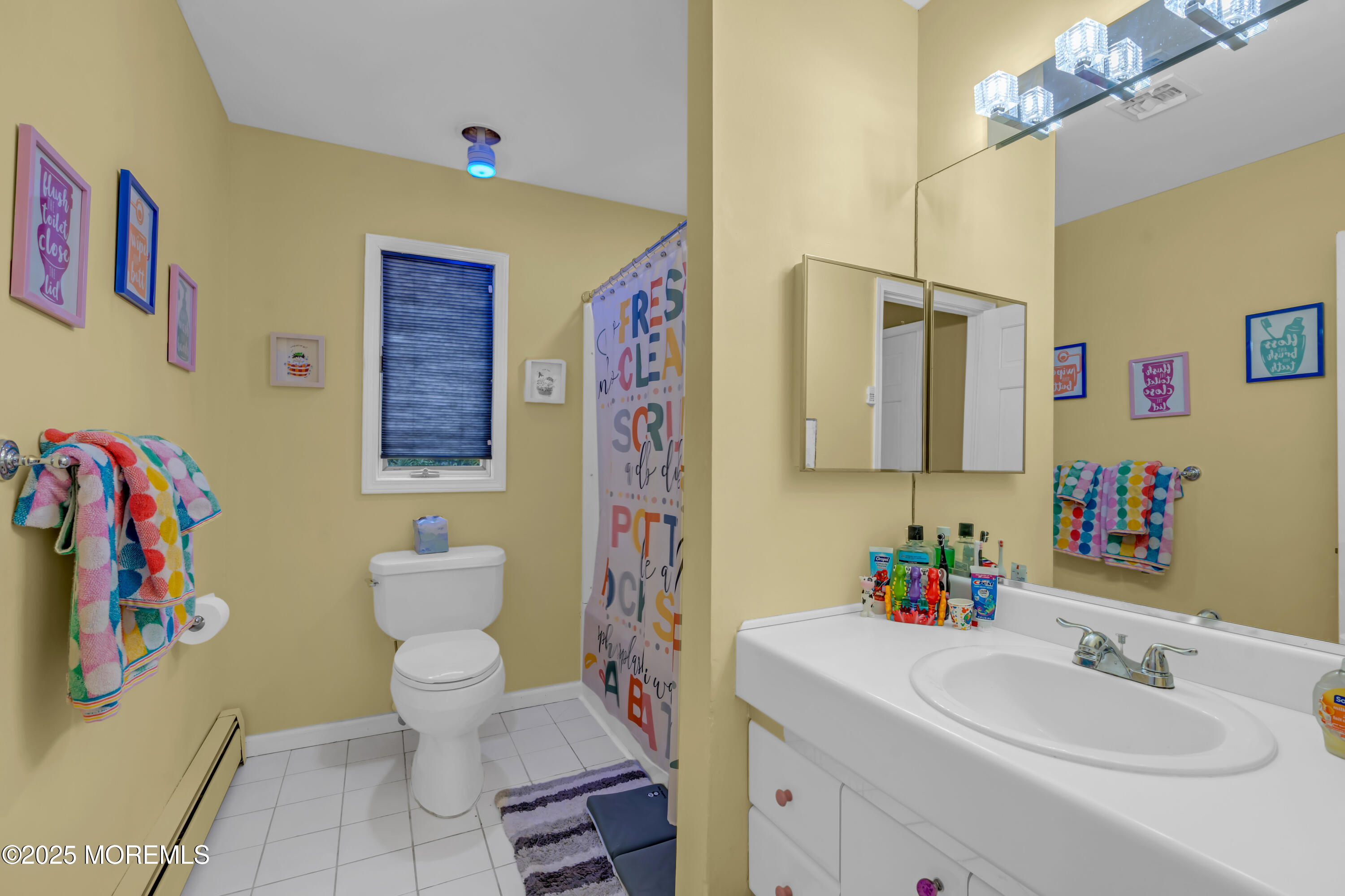 581 Winding River Road Brick, NJ 08724 - Photo 44 of 91 a bathroom with a sink mirror vanity and toilet