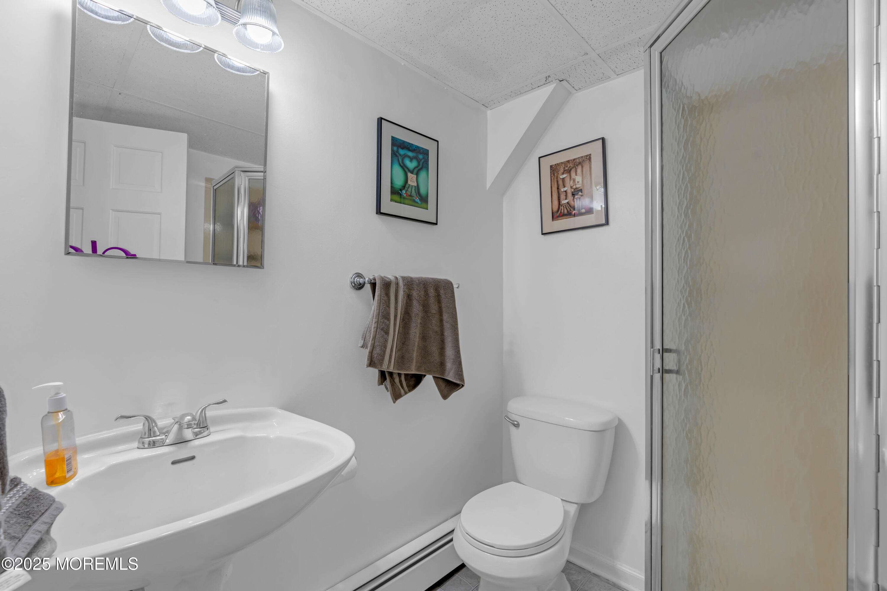 581 Winding River Road Brick, NJ 08724 - Photo 50 of 91 a bathroom with a sink mirror vanity and toilet