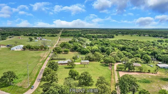 a view of a lake with a yard