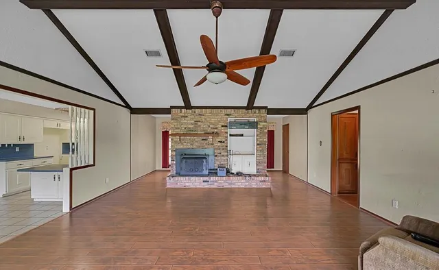 a view of a livingroom with fireplace and furniture