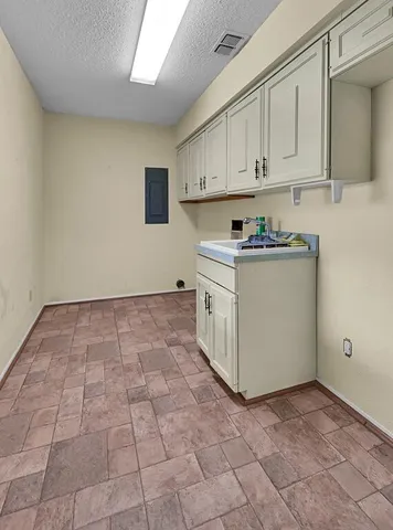 a view of a kitchen with electric appliances