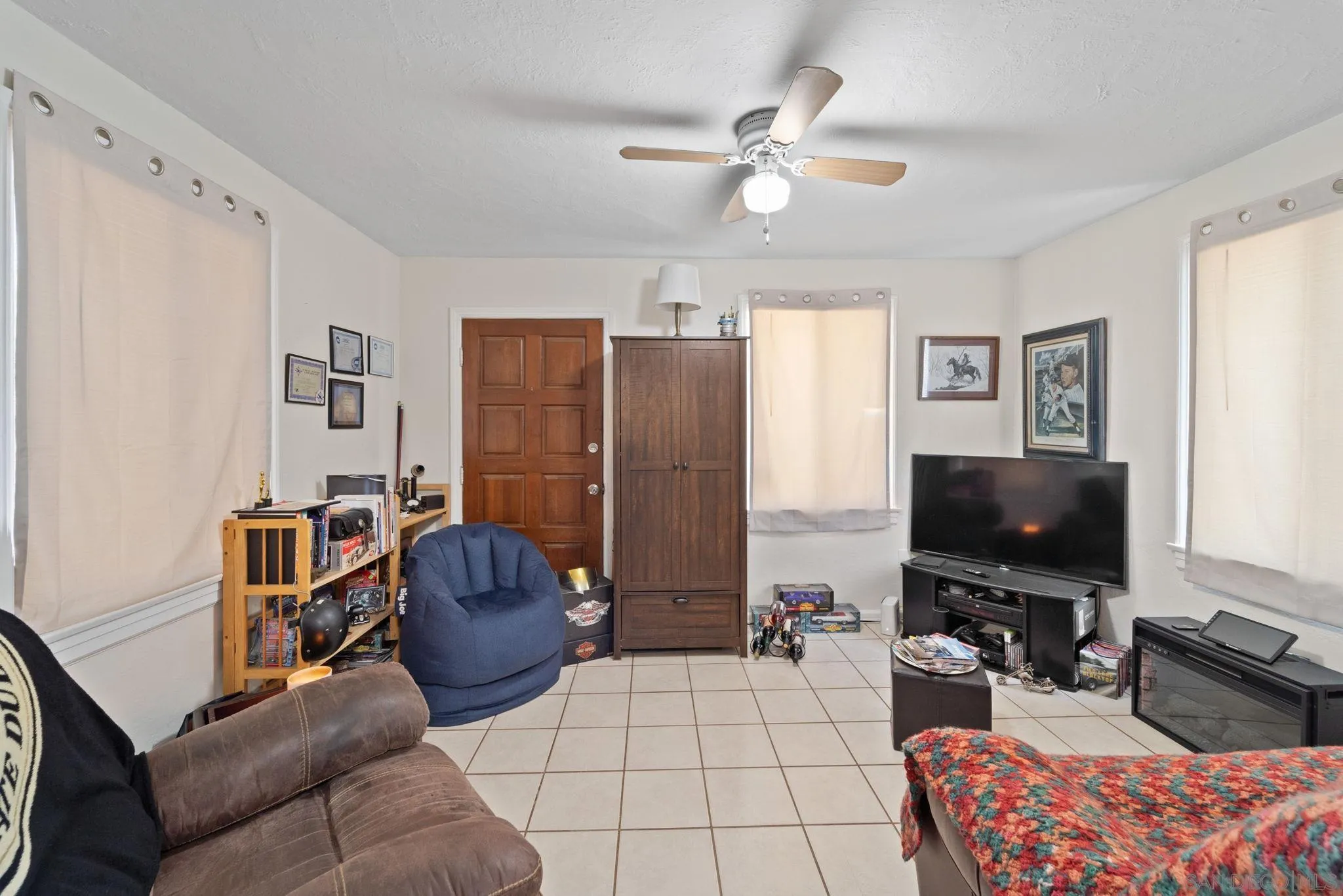 345 Cedar Street El Cajon, CA 92021 - Photo 12 of 19 a living room with furniture and a flat screen tv