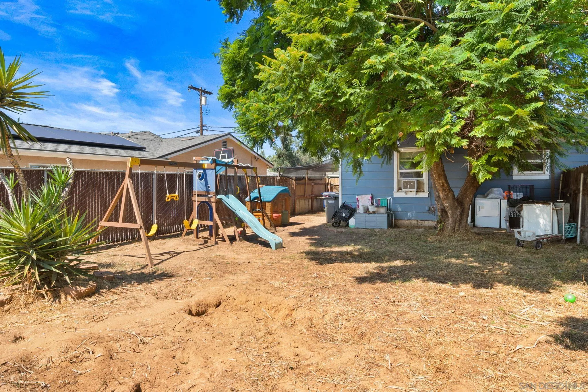 345 Cedar Street El Cajon, CA 92021 - Photo 13 of 19 a view of a yard with a tree