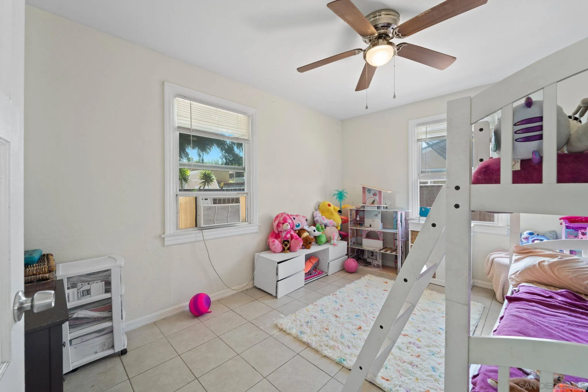 345 Cedar Street El Cajon, CA 92021 - Photo 6 of 19 a bedroom with furniture and a chandelier fan