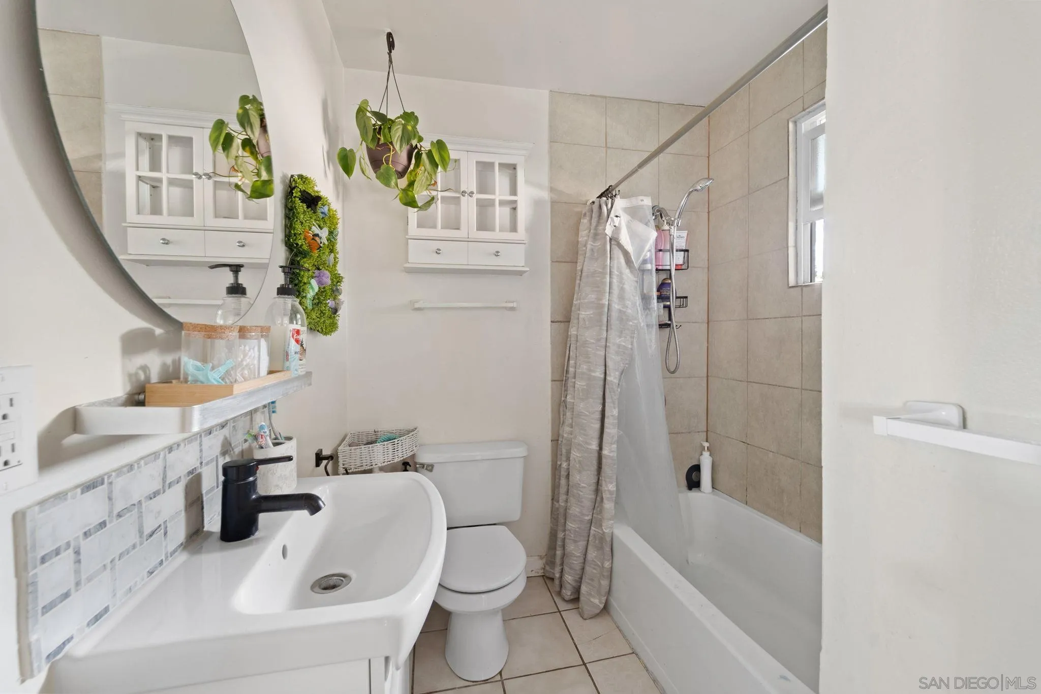 345 Cedar Street El Cajon, CA 92021 - Photo 7 of 19 a bathroom with a sink a toilet and shower